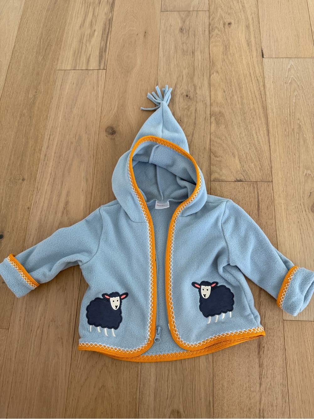 Hanna Andersson light blue sweater with mustard trim